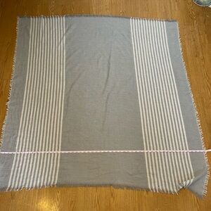 Gray and white stripe blanket scarf.